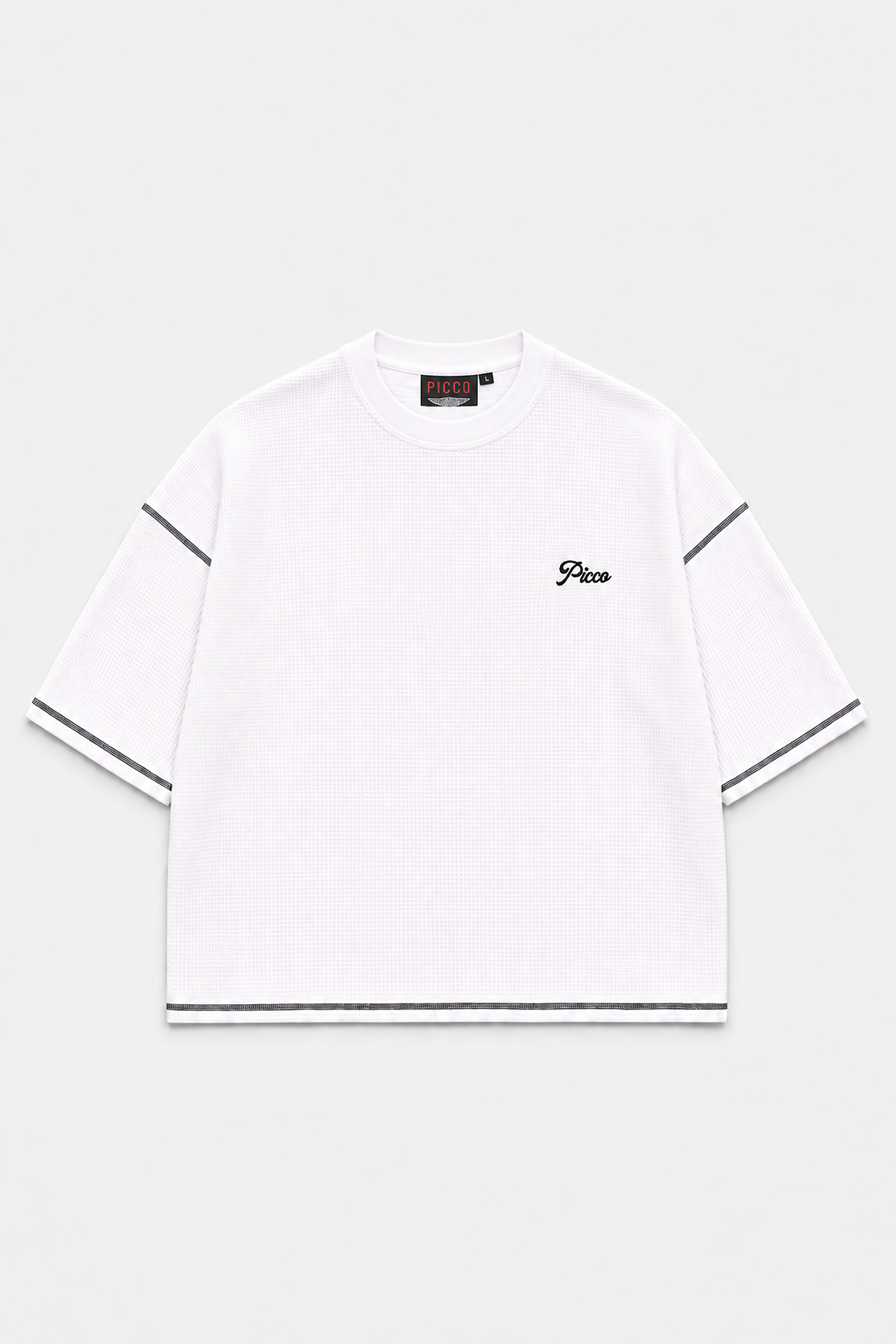 Front of the white Picco Waffle Tee with black embroidered chest logo and contrast stitching